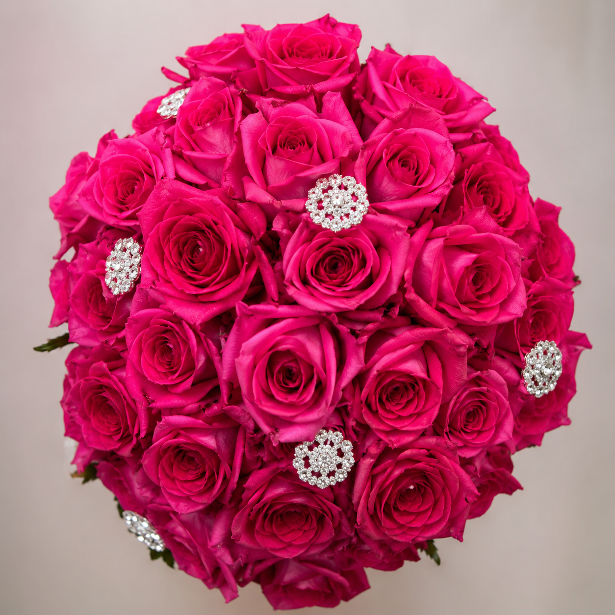 Quinceañera bouquet of hot pink roses with crystal brooch accents